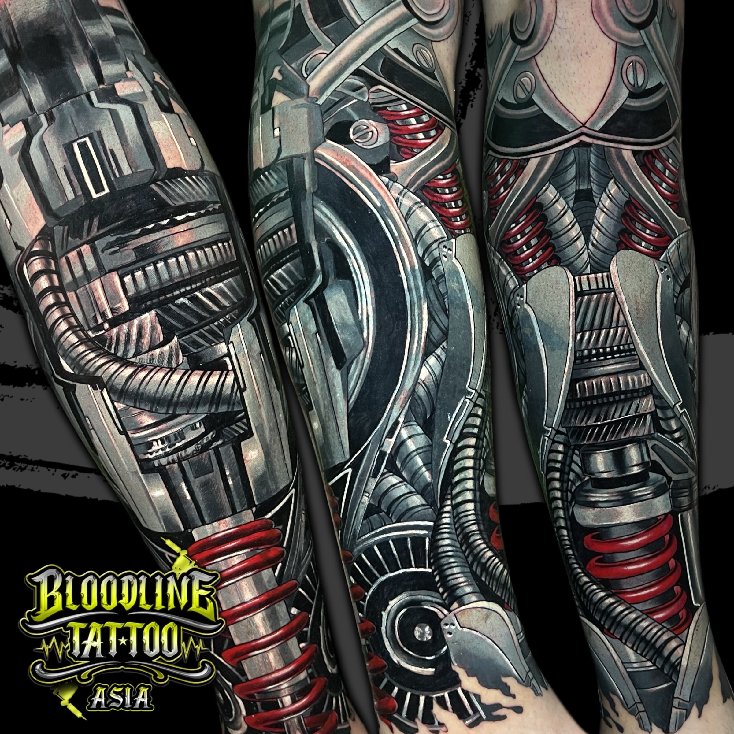 Colour biomechanical leg tattoo with metallic gears, pistons, and bright red coiled springs wrapping the limb at Bloodline Tattoo Bali.
