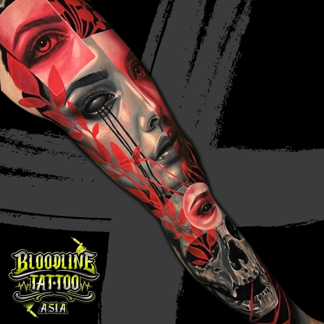 Colour trash polka full sleeve tattoo with realistic female faces, red leaves, and a detailed skull on the arm at Bloodline Tattoo Bali.