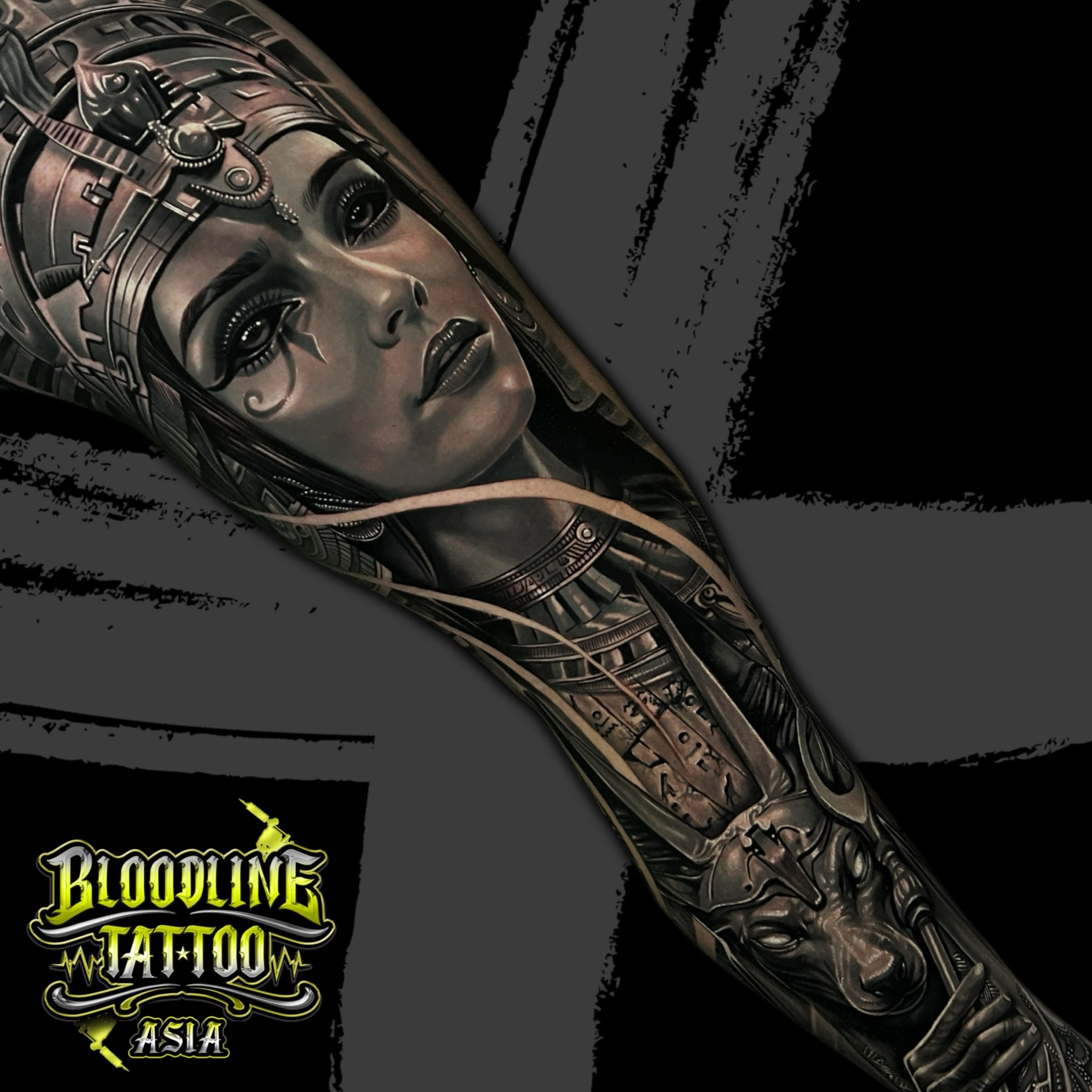 Colour Egyptian full arm sleeve tattoo with a queen portrait, ornate headdress, and Anubis in black and grey realism at Bloodline Tattoo Bali.