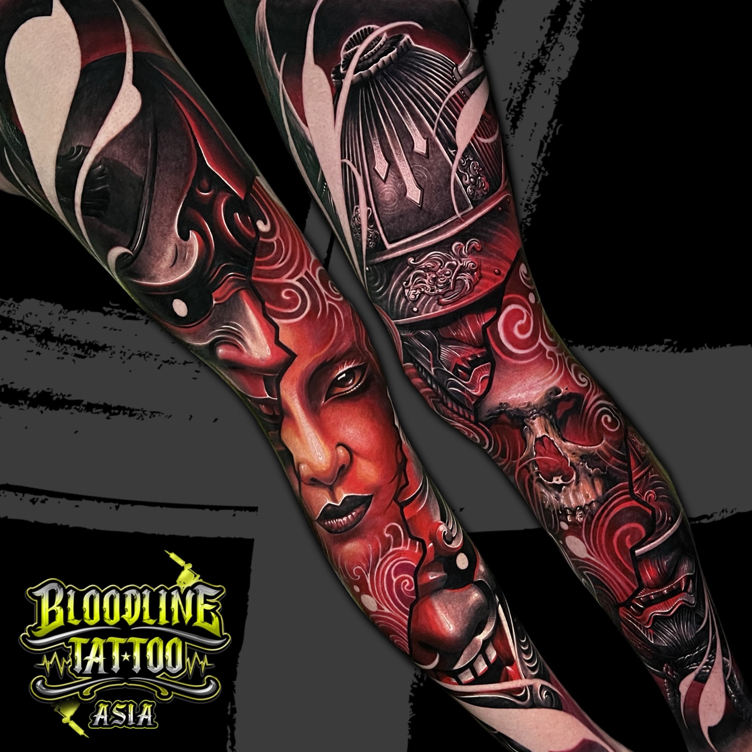 Colour Japanese full arm sleeve tattoo with a woman's face, samurai helmet, Hannya mask, skull, and red black patterns at Bloodline Tattoo Bali.