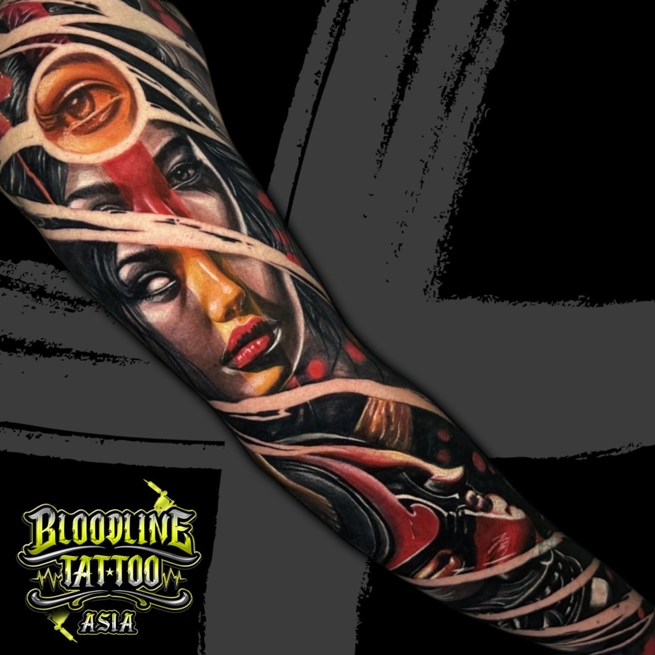 Colour surreal full sleeve tattoo of a woman's face with a glowing third eye, red light streaks, and pale bandage wraps at Bloodline Tattoo Bali.